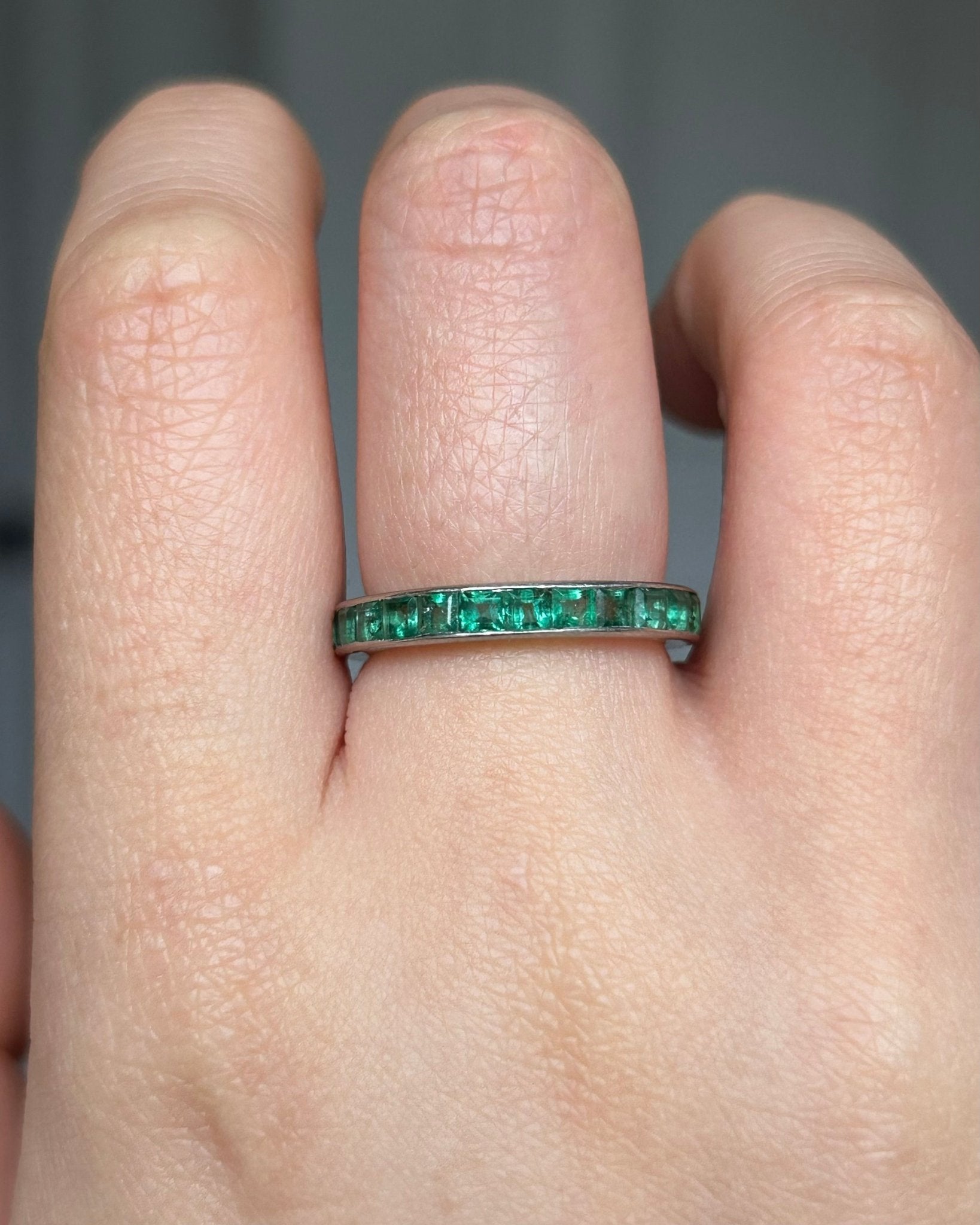 Platinum French emerald eternity band - Golden Green Obsession
