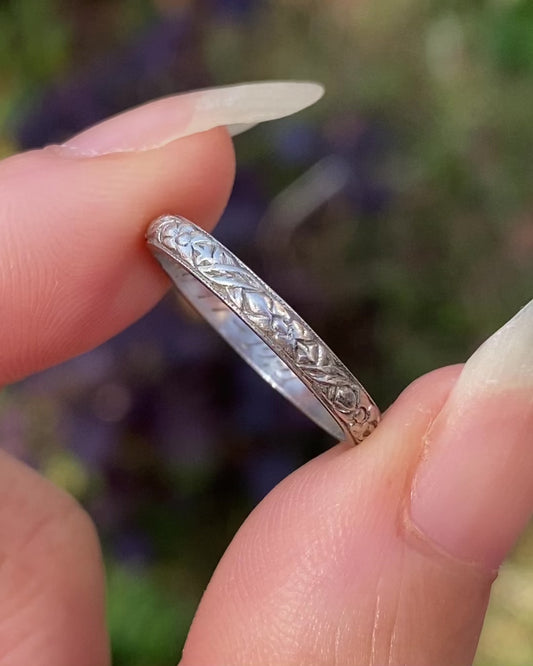 Antique platinum band with floral engraving